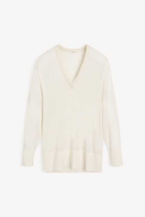 White sweater on a light beige background