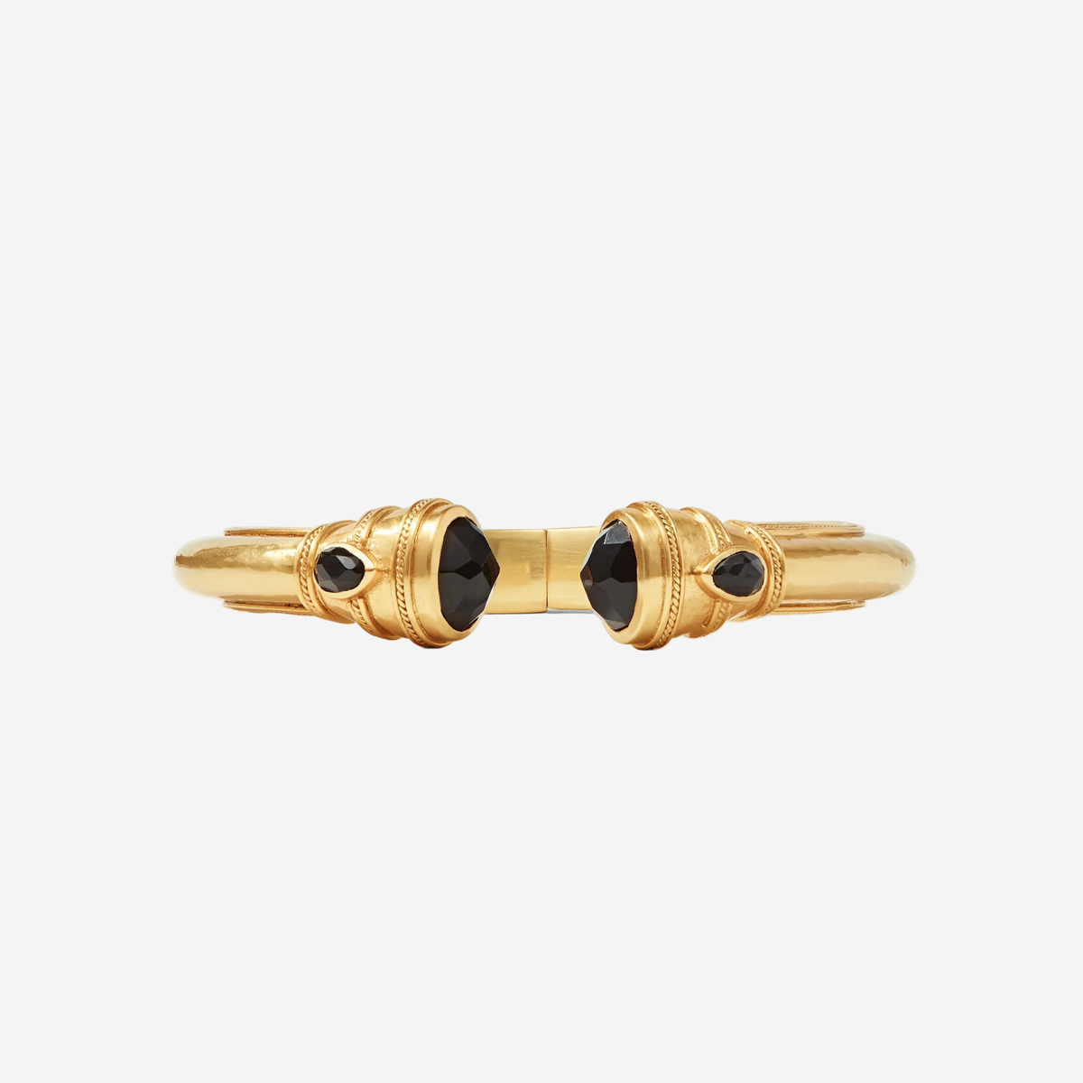 Gold bracelet with black gemstones on a white background