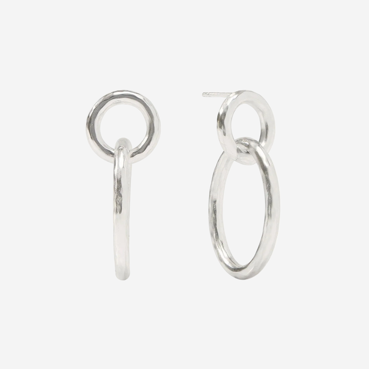 Pair of silver hoop earrings on a white background