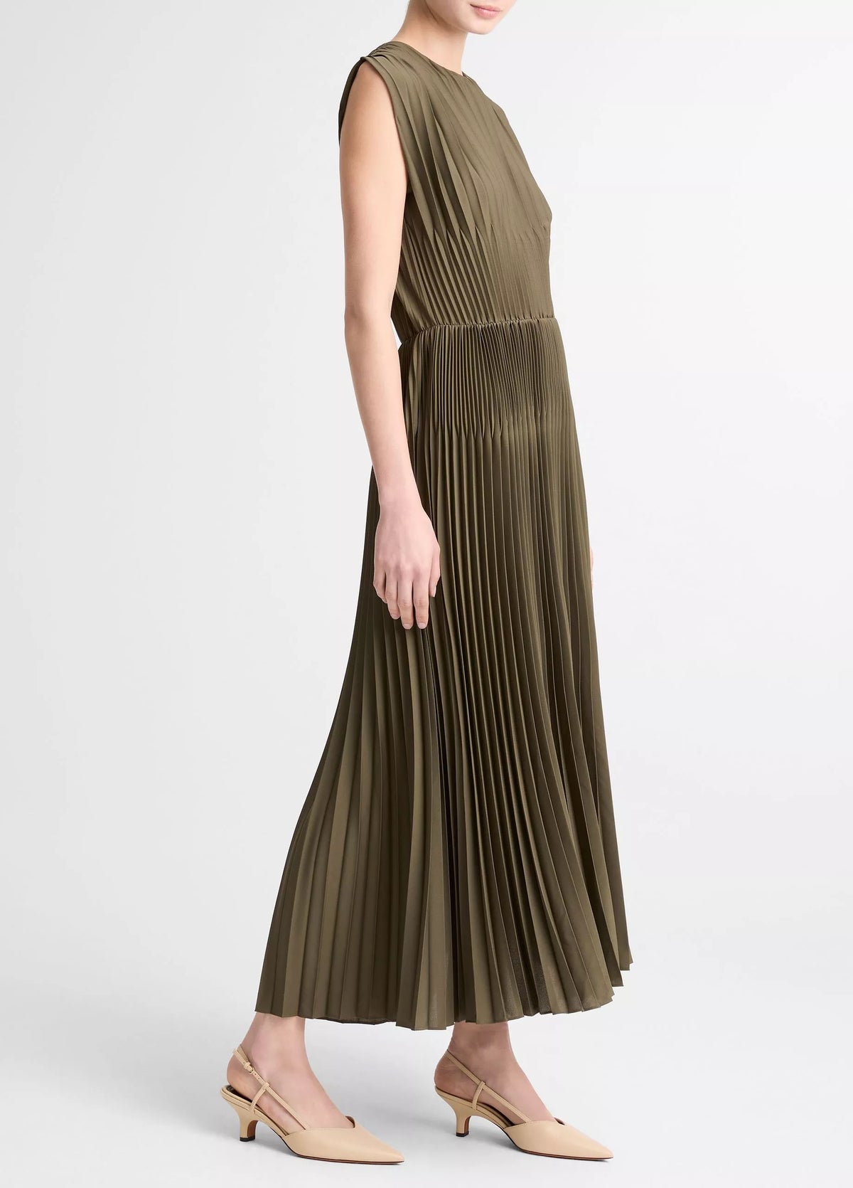 green pleated dress on a model