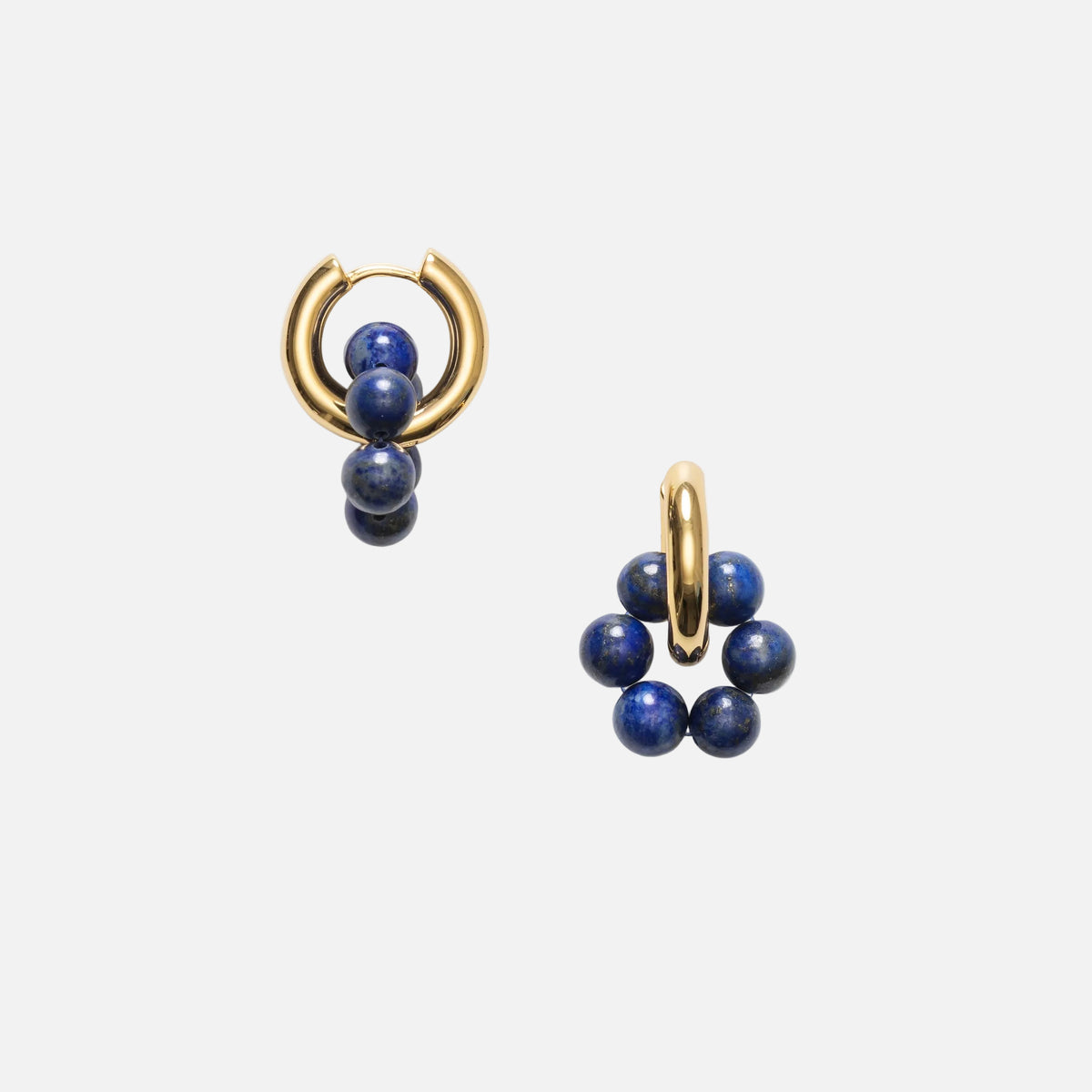 Pair of gold hoop earrings with blue beads on a white background