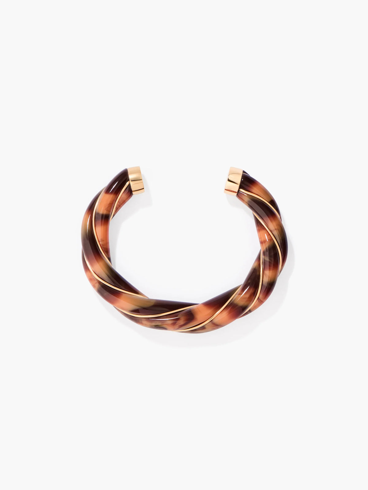 Tortoiseshell bangle with gold accents on a white background