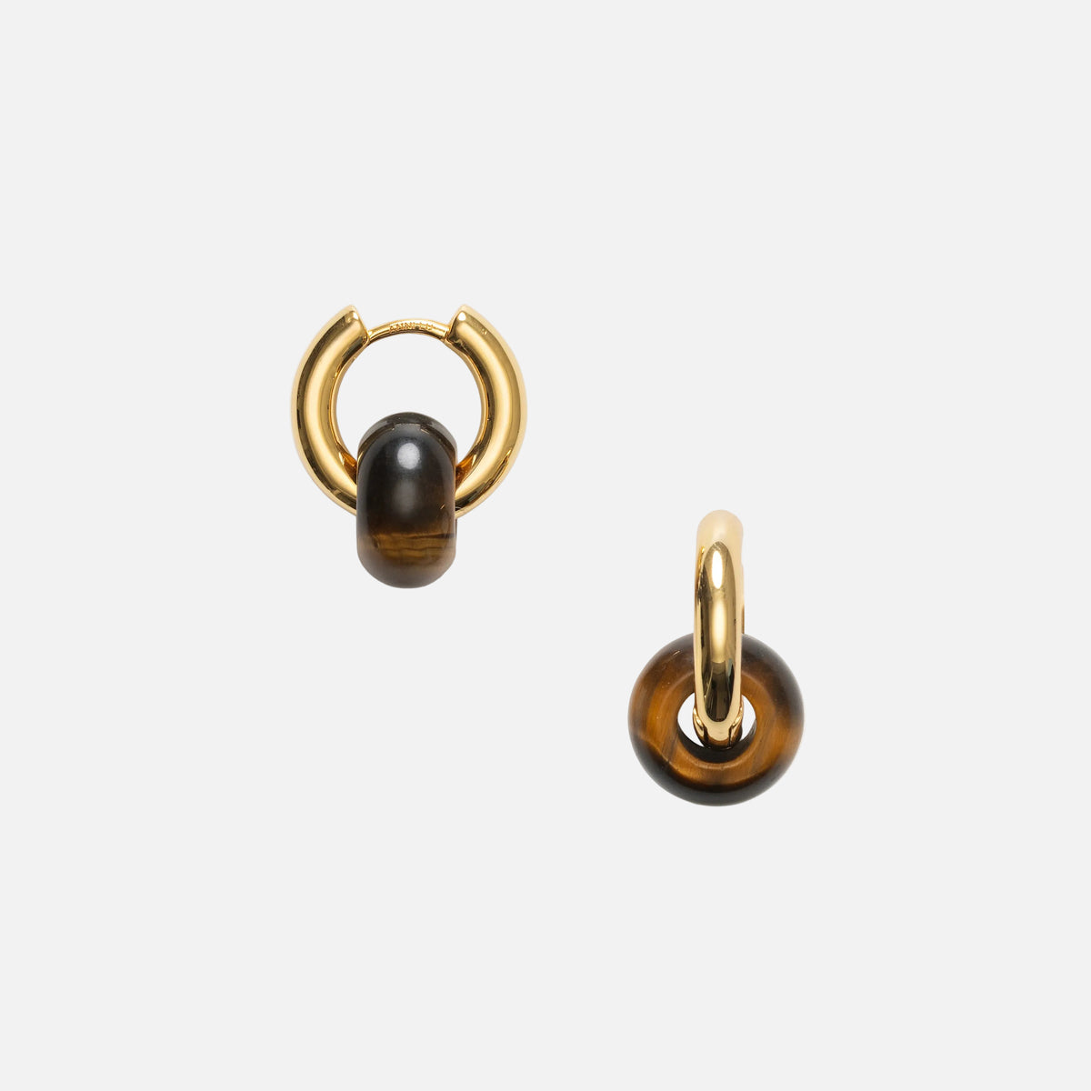 Pair of gold hoop earrings with black gemstones on a white background