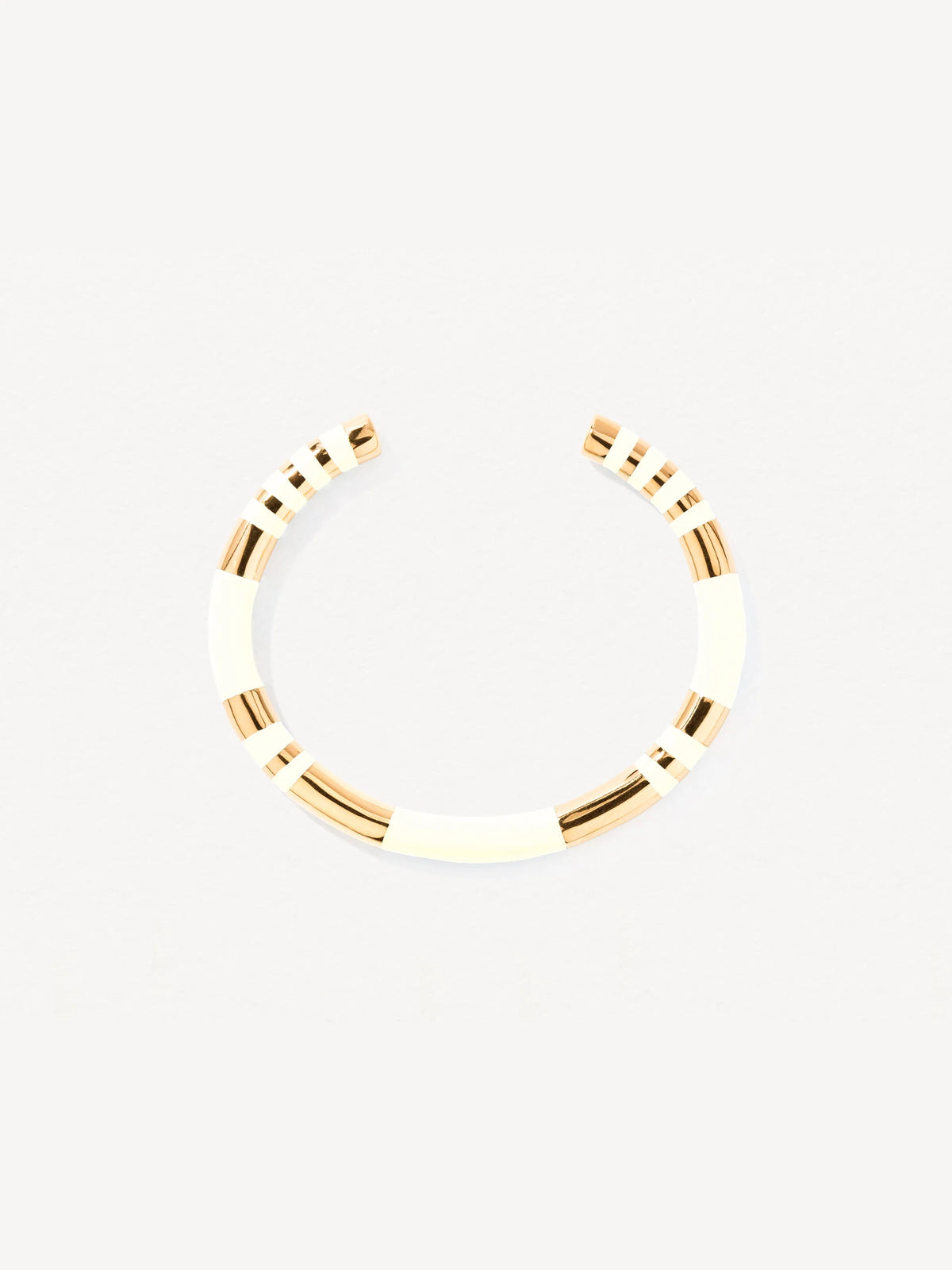 Gold bangle on a white background