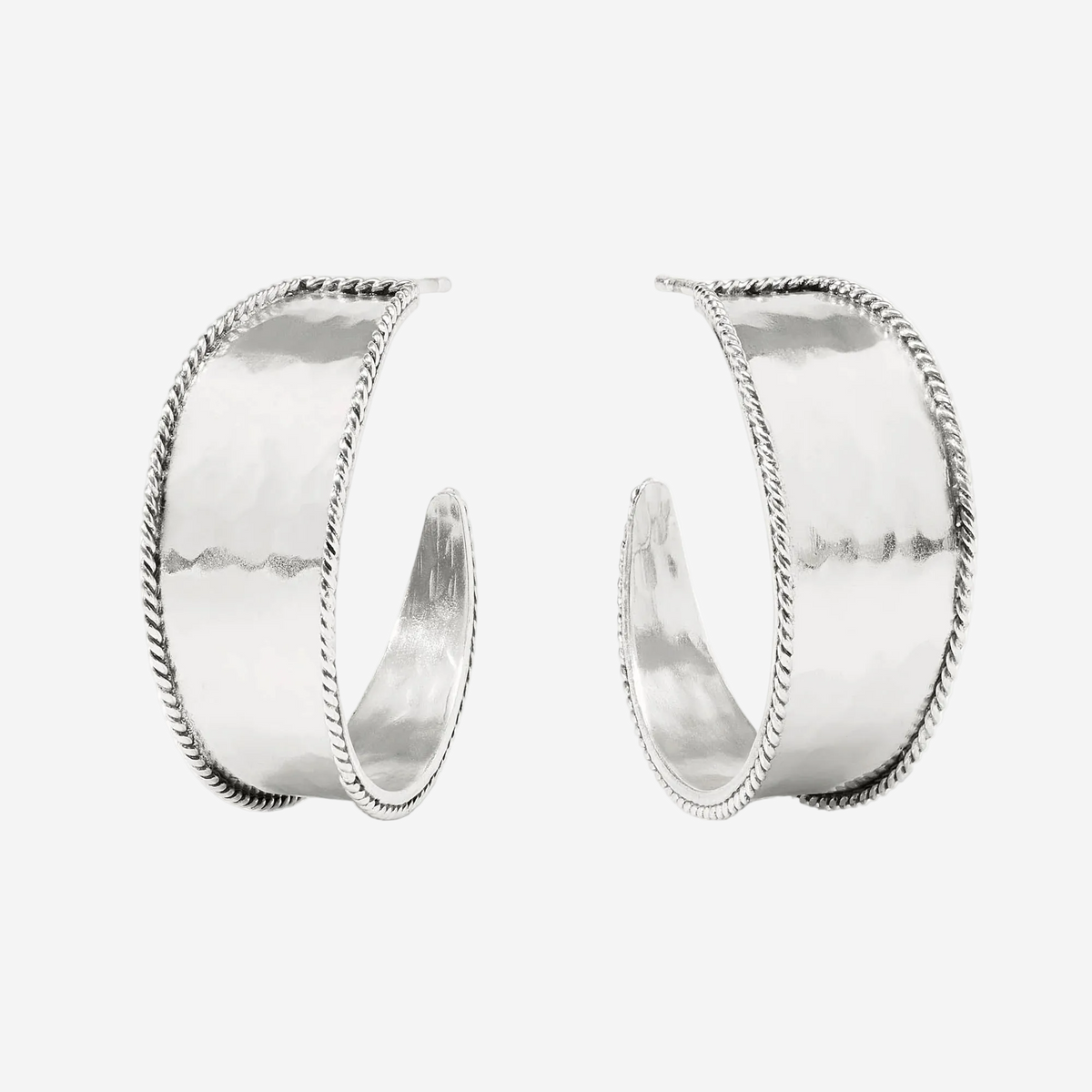 Pair of silver hoop earrings on a white background