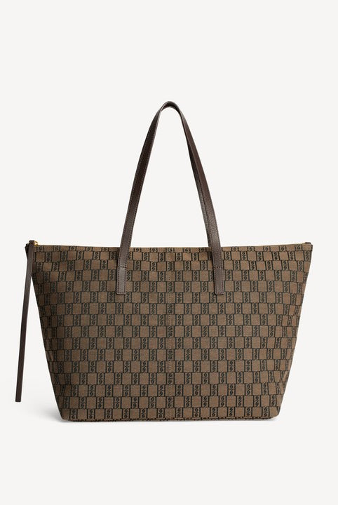 Brown patterned tote bag with brown handles on a light gray background