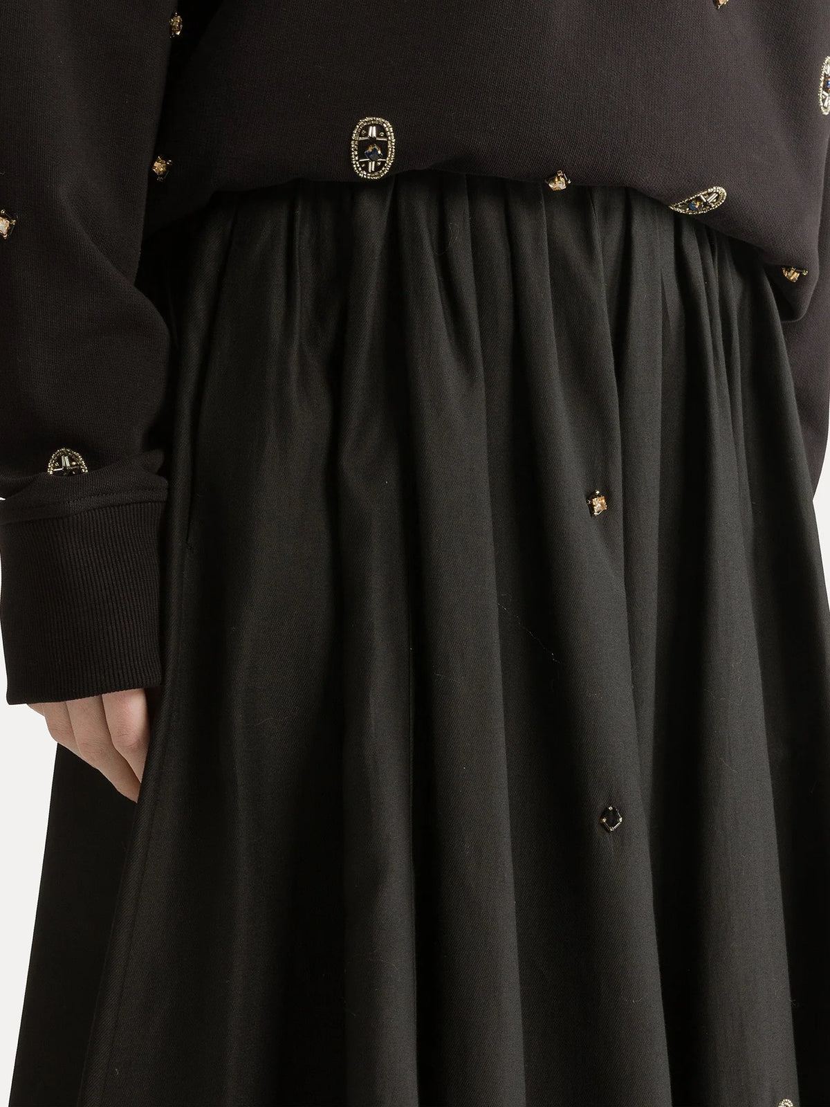Black coat with gold buttons on a white background