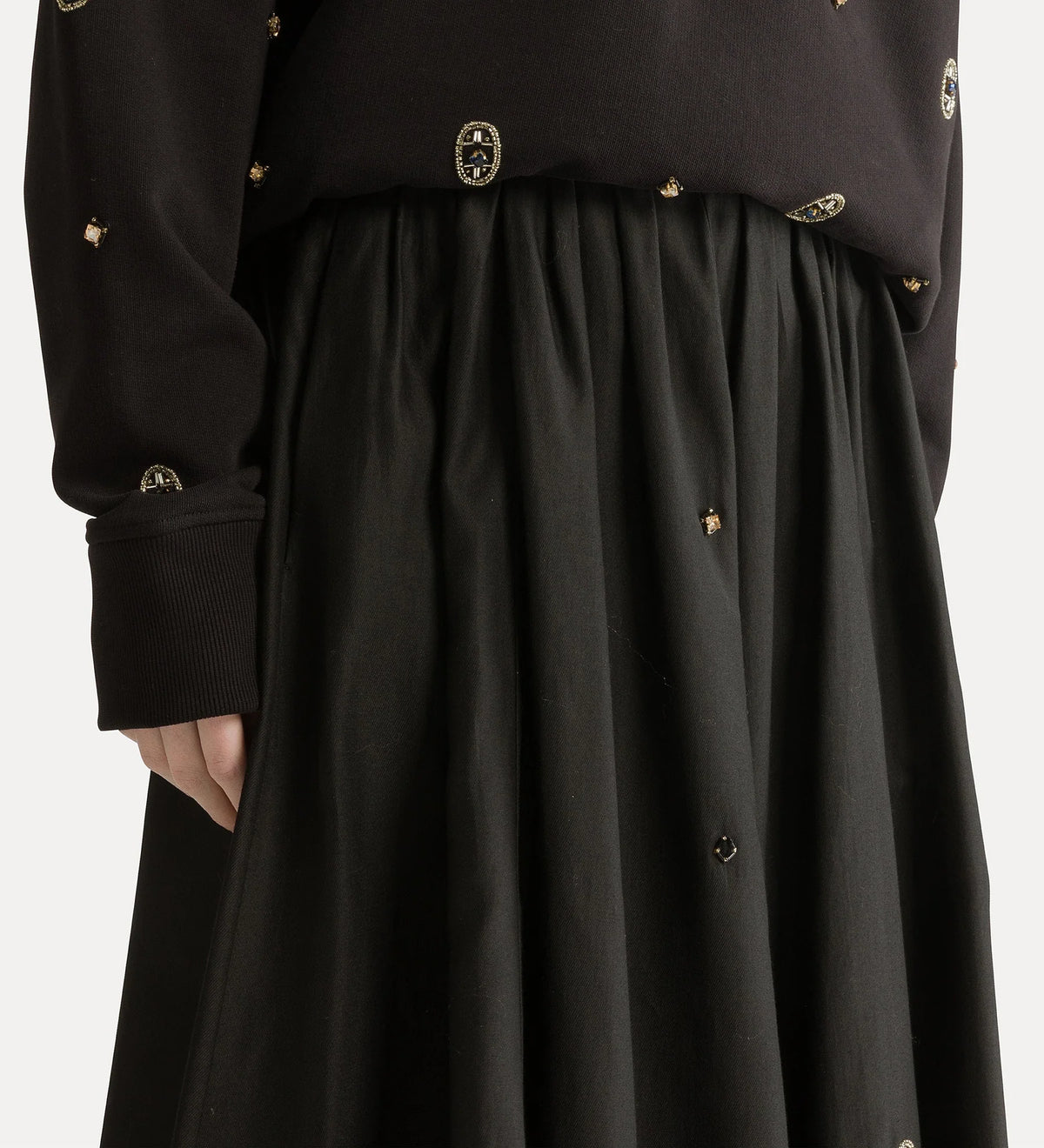 Black coat with gold buttons on a white background