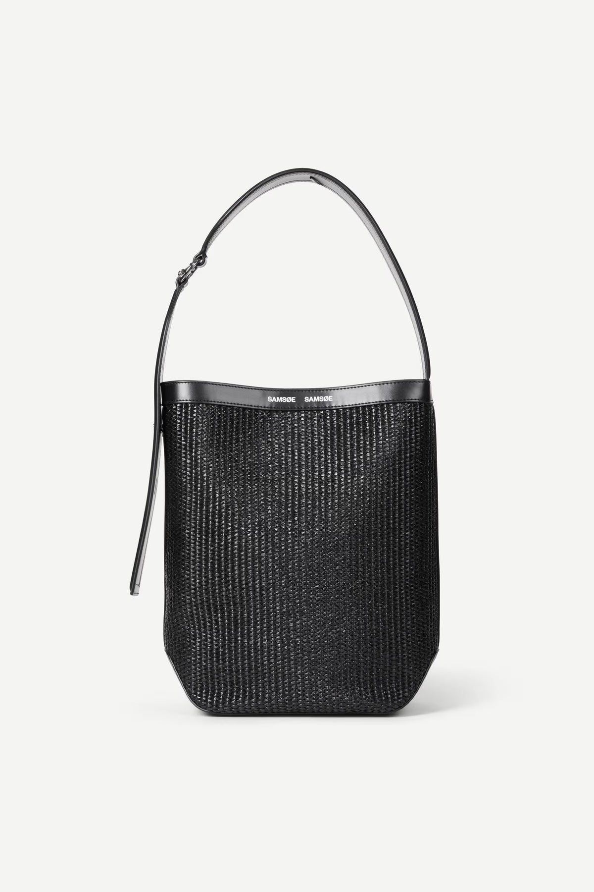 Black woven handbag with a metallic handle on a white background