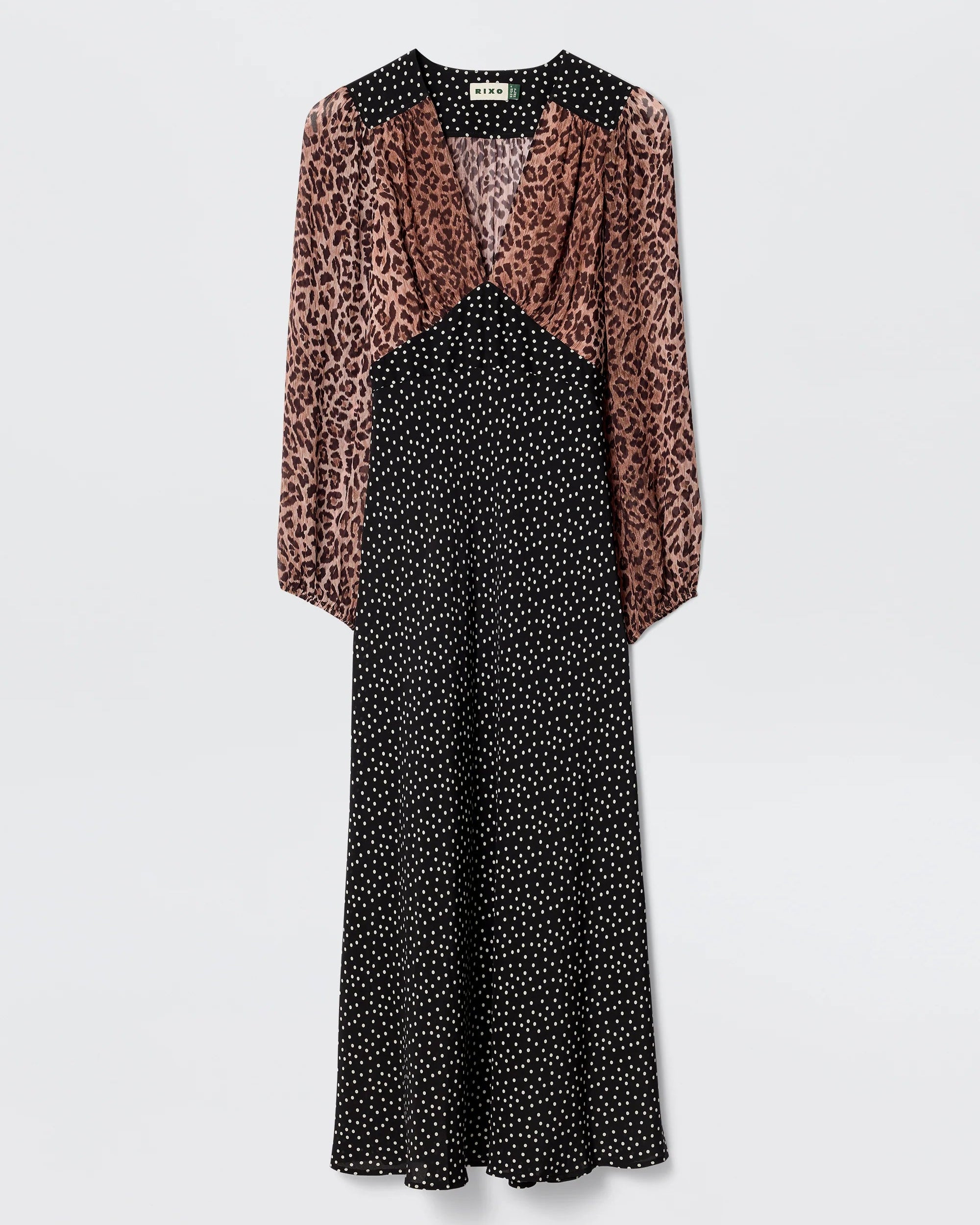 Dress with leopard print sleeves and black polka dot bodice on a white background