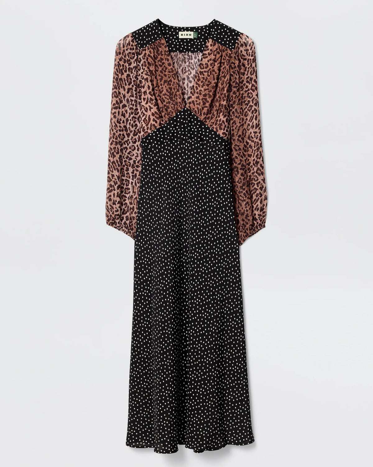 Dress with leopard print sleeves and black polka dot bodice on a white background