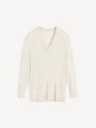 White sweater on a light beige background