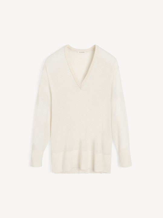 White sweater on a light beige background