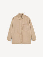 Beige shirt with a pocket on a white background