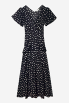 Black dress with white polka dots on a white background