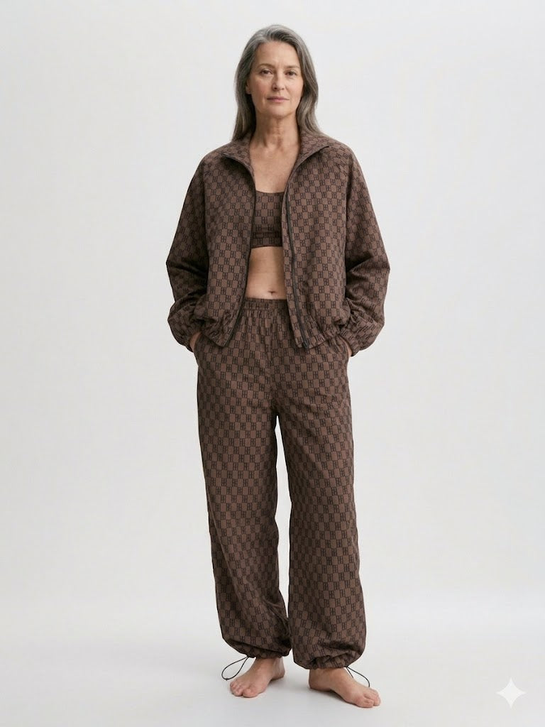 Woman wearing a brown patterned outfit on a white background