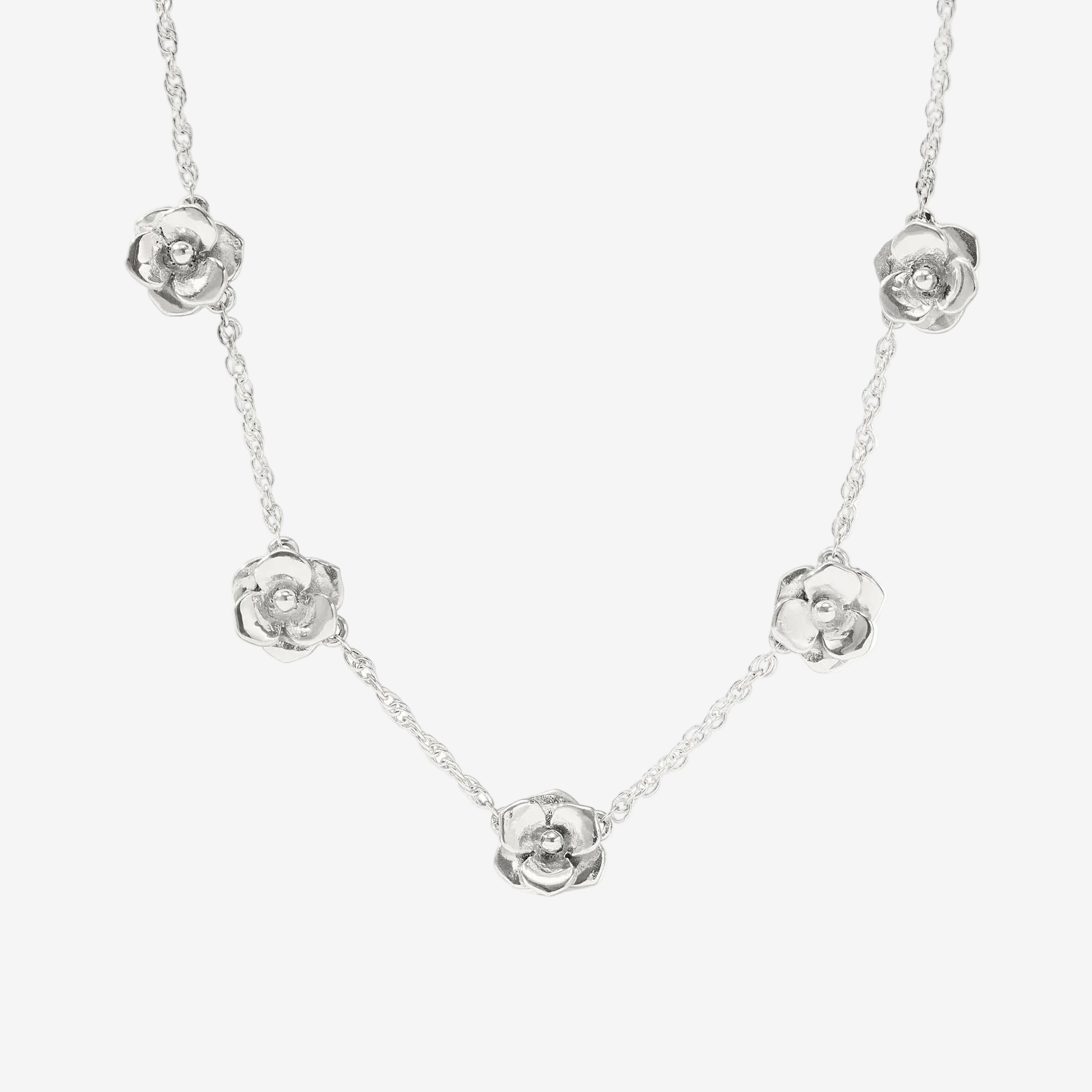 Silver necklace with floral pendants on a white background