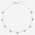 Silver necklace with floral designs on a white background