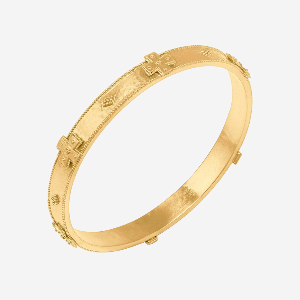 Gold bracelet with intricate designs on a white background