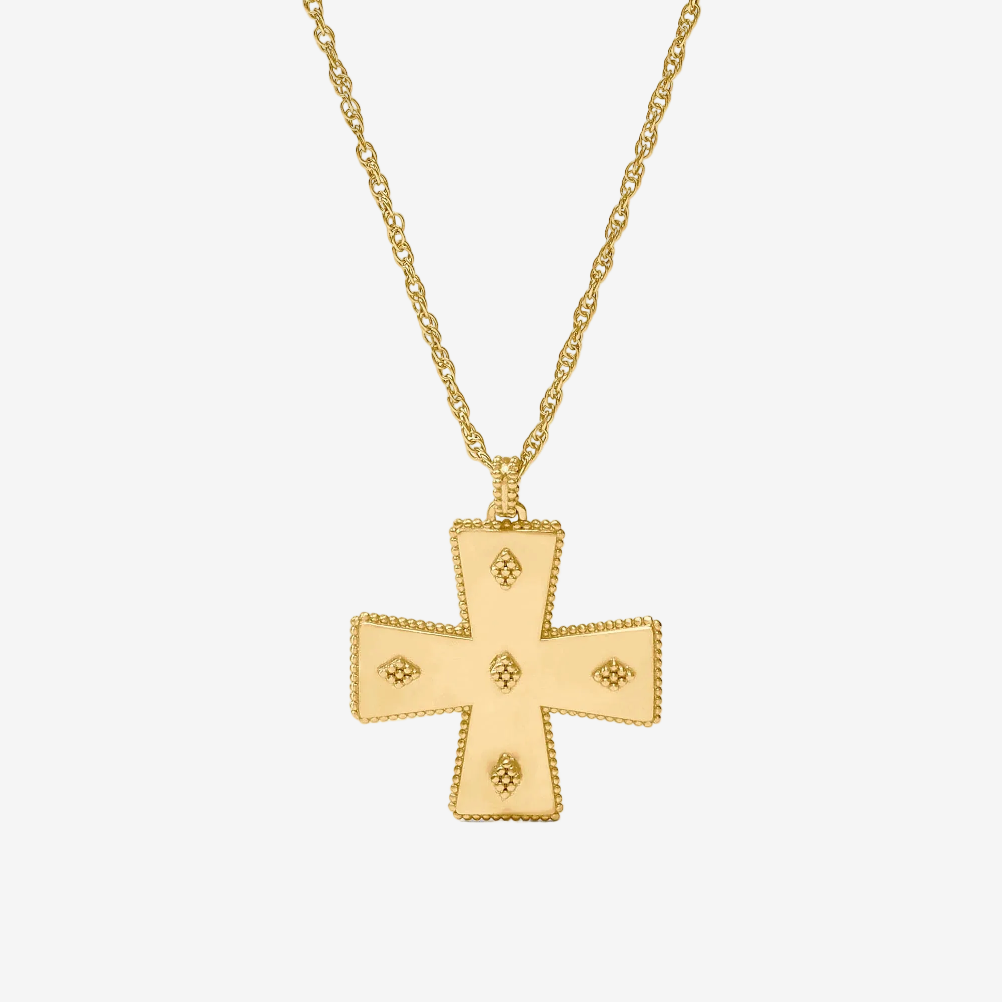 Gold cross pendant necklace on a white background
