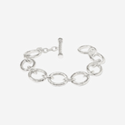 Silver chain bracelet with a clasp on a white background