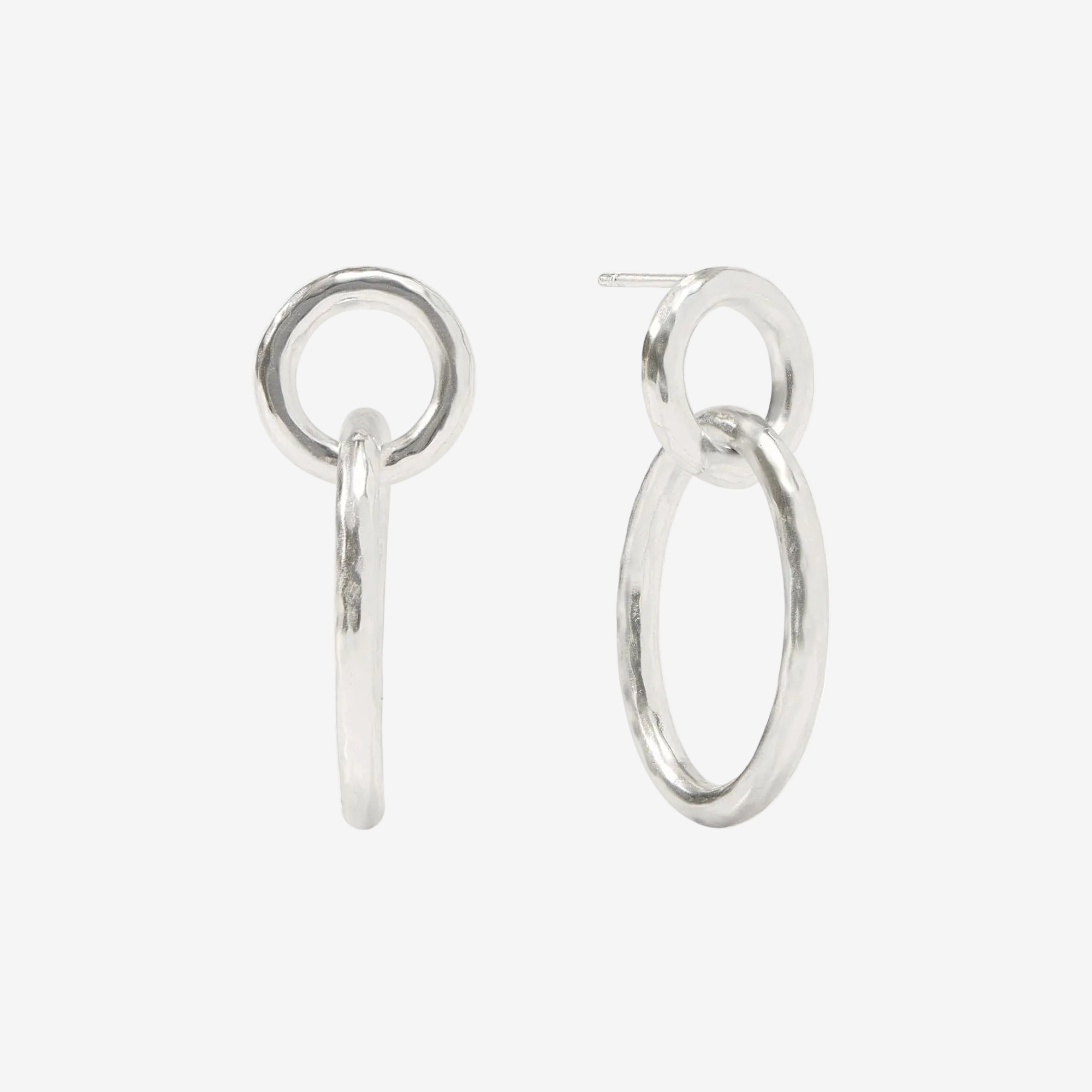 Pair of silver hoop earrings on a white background