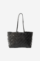 Black woven handbag on a white background