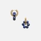 Pair of gold hoop earrings with blue beads on a white background