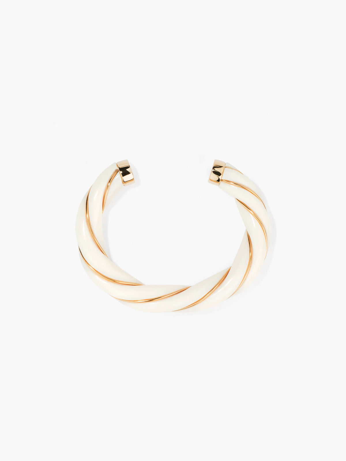 Gold cuff bangle on a white background