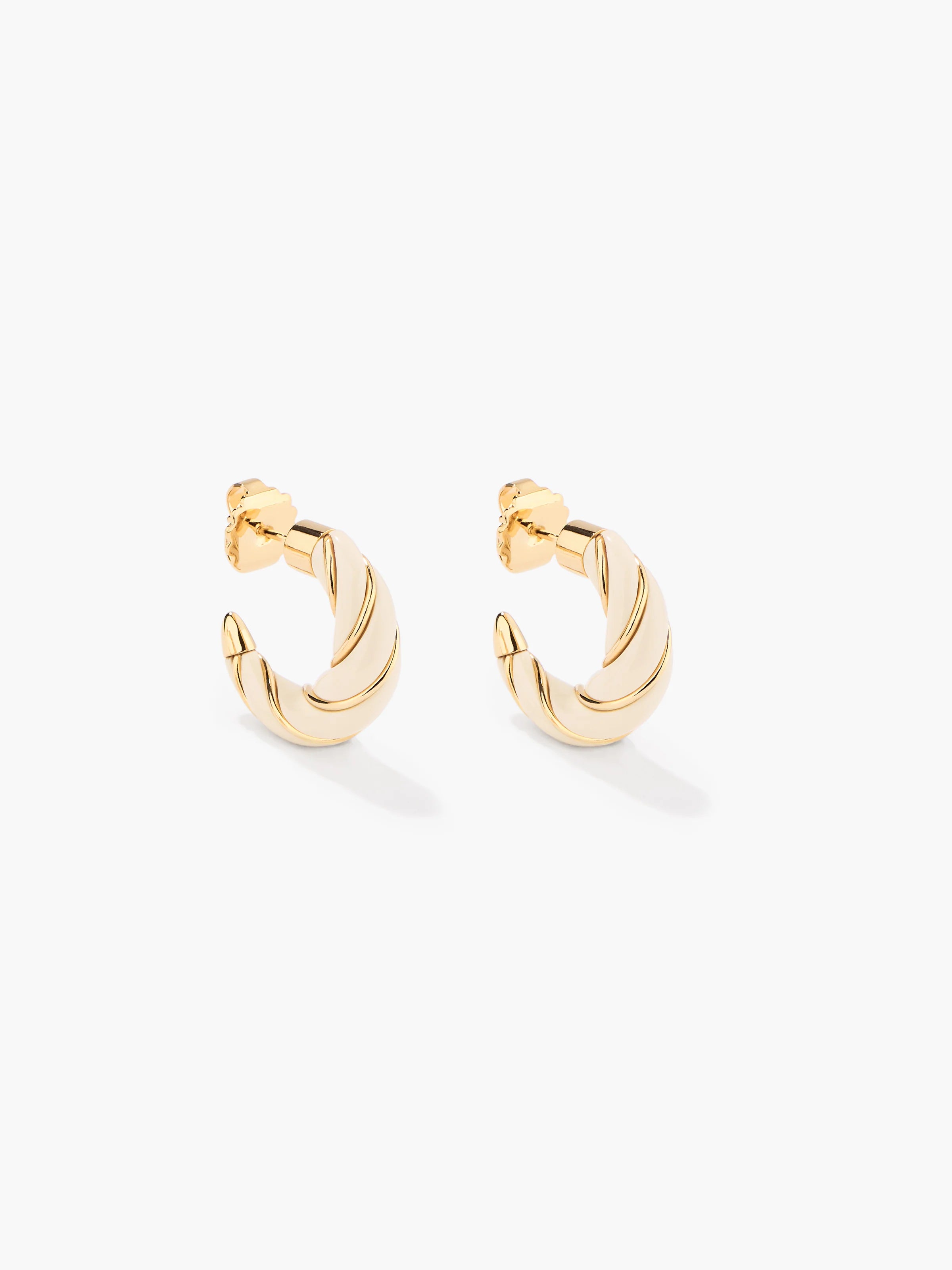 Gold hoop earrings on a white background