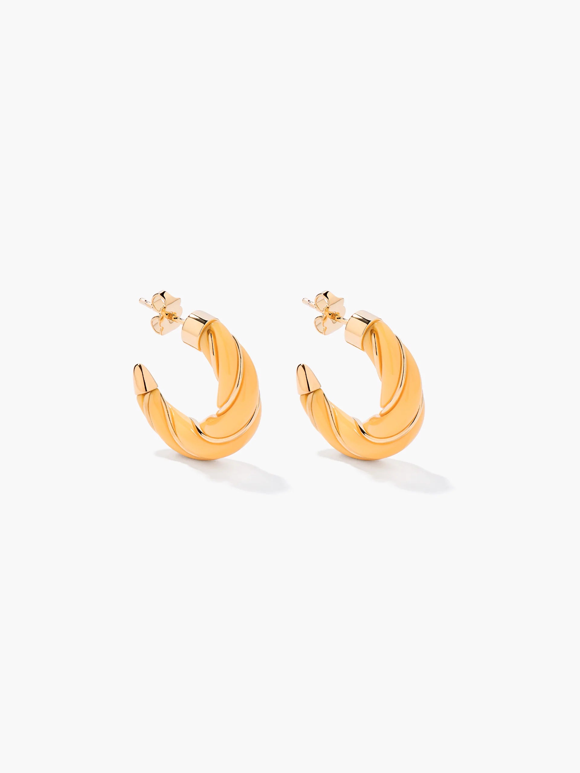 yellow and gold twisted hoops