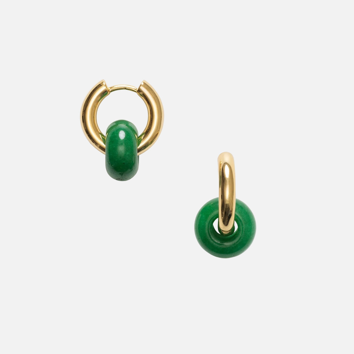 Gold hoop earrings with green beads on a white background