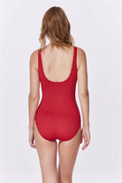 Red swimsuit worn by a model on a white background