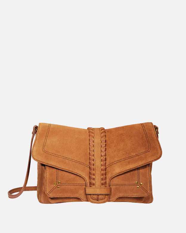 Brown suede handbag on a white background