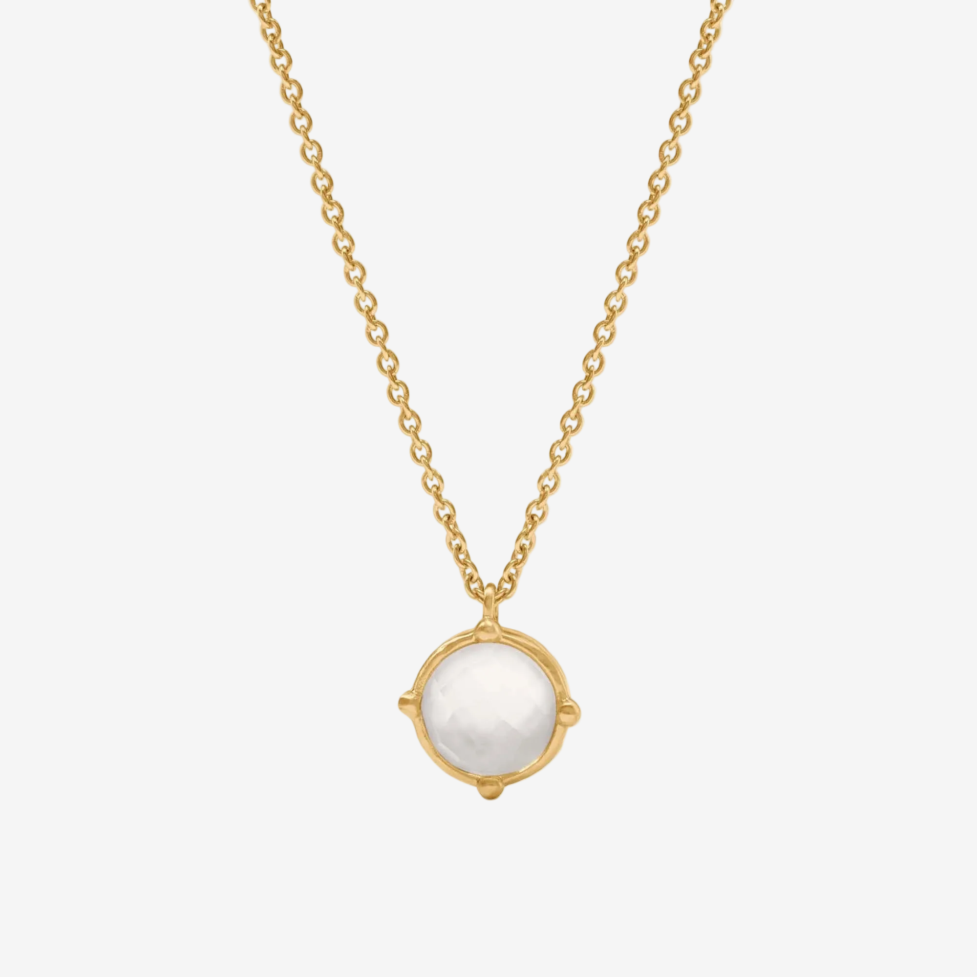 Gold necklace with a white pendant on a white background