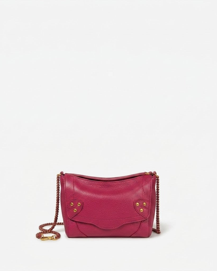 Pink handbag with gold chain on a white background