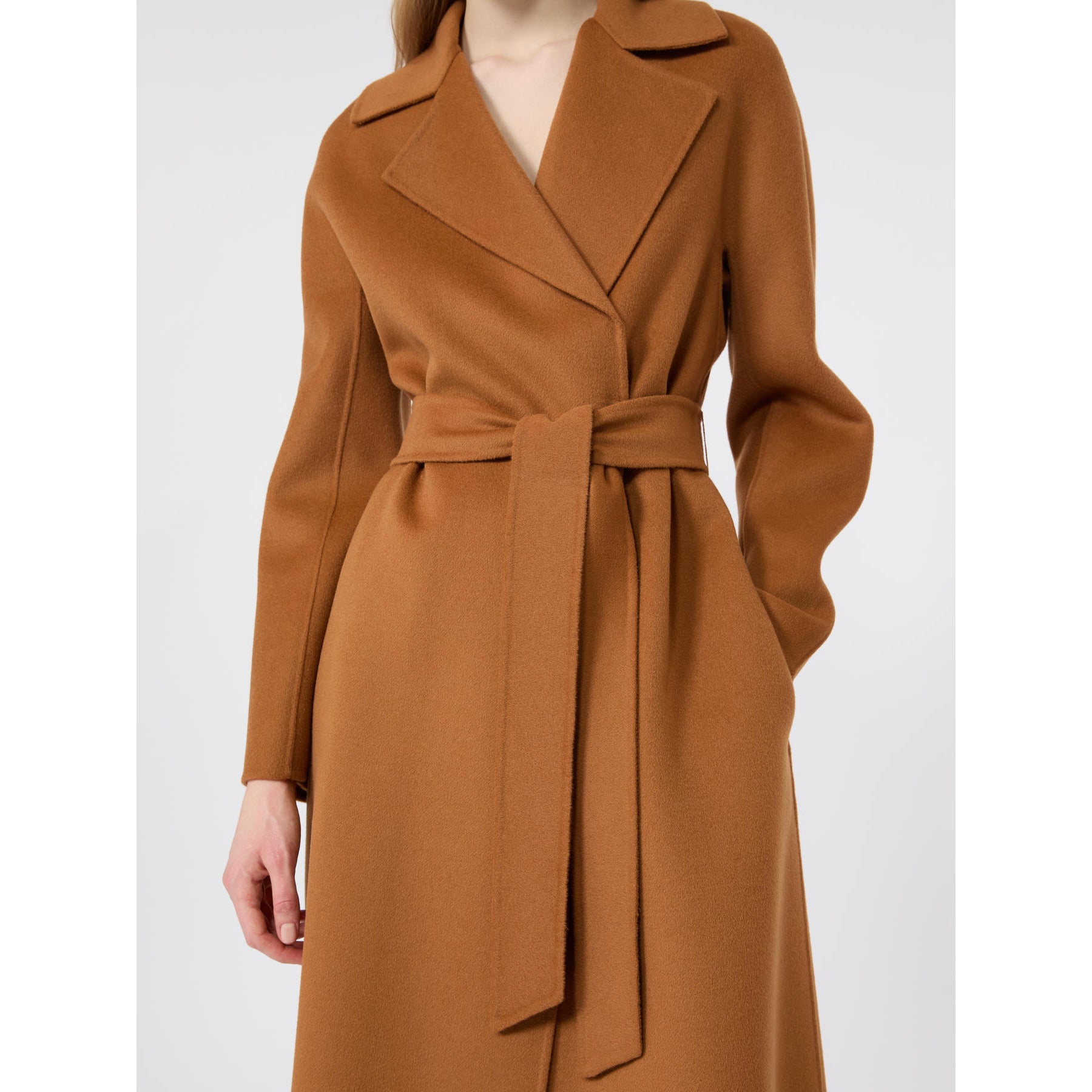 Brown coat with a belt on a white background