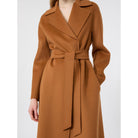 Brown coat with a belt on a white background