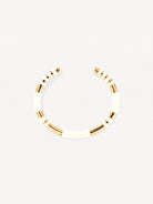Gold bangle on a white background