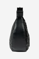 Black leather sling bag on a white background
