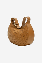 Brown woven handbag on a white background