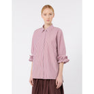 Woman wearing a pink and white striped shirt on a white background