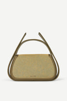 Green handbag with unique handle design on a white background