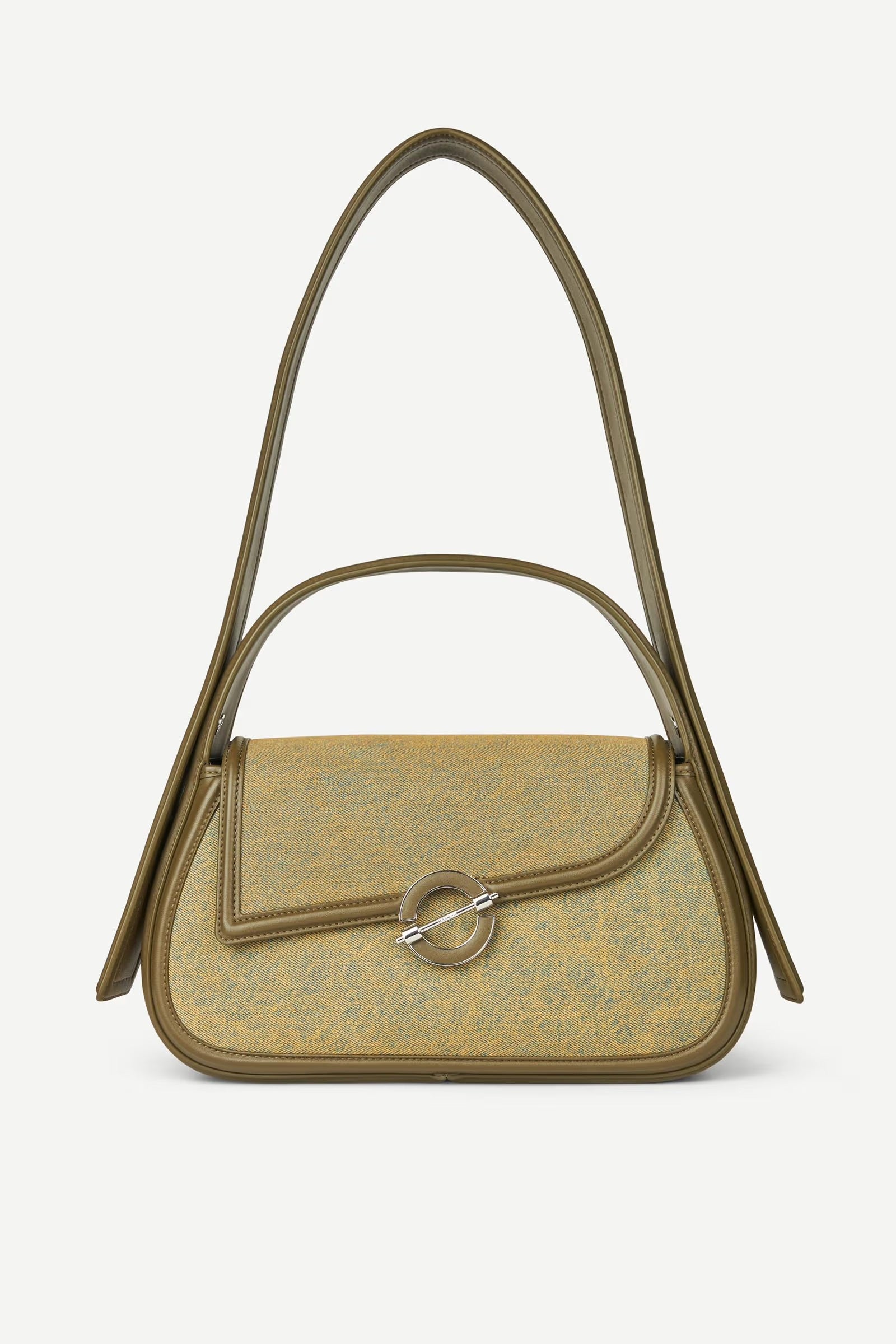 Green handbag with a decorative ring on a white background