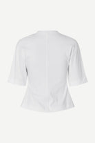 White blouse with a V-neckline on a white background