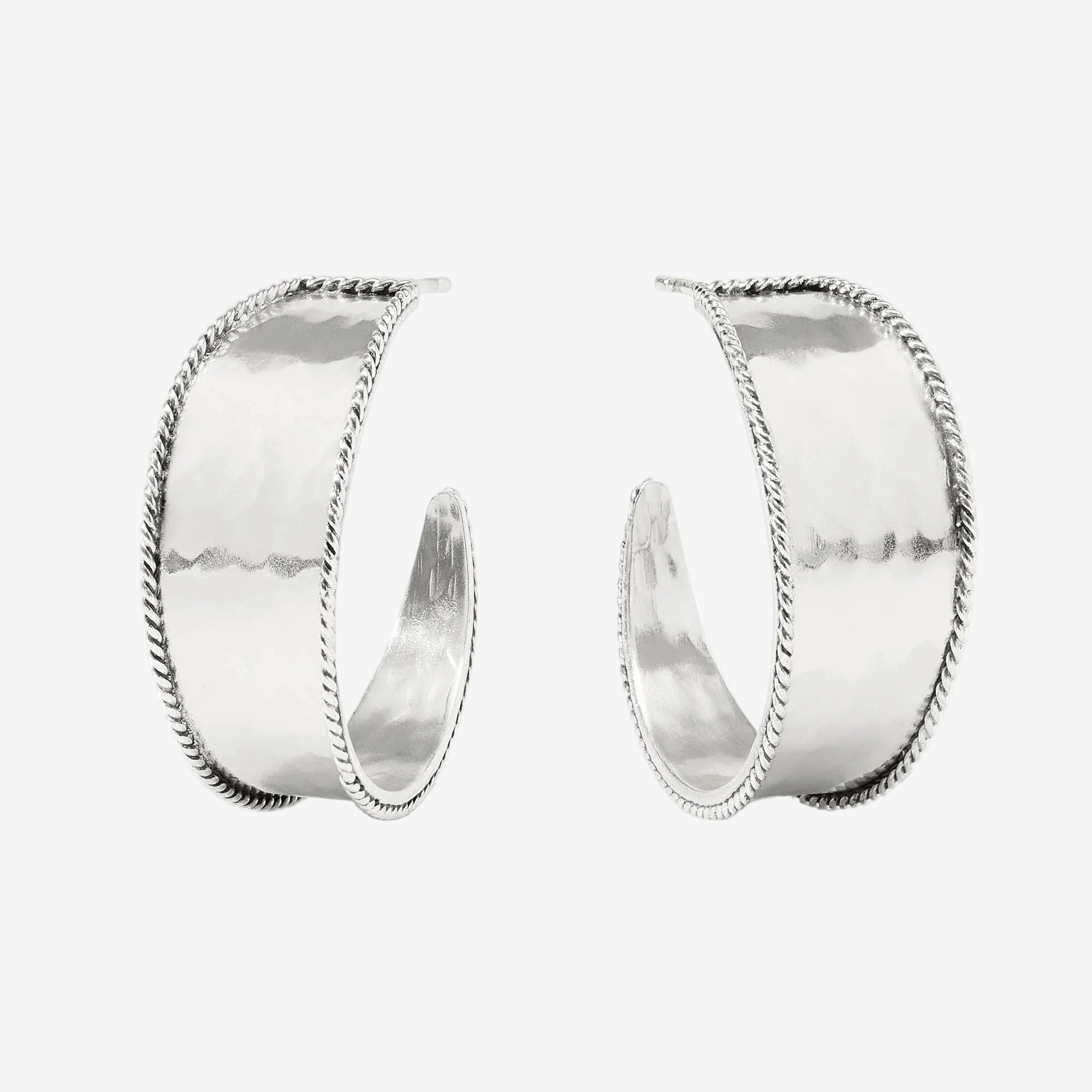 Pair of silver hoop earrings on a white background