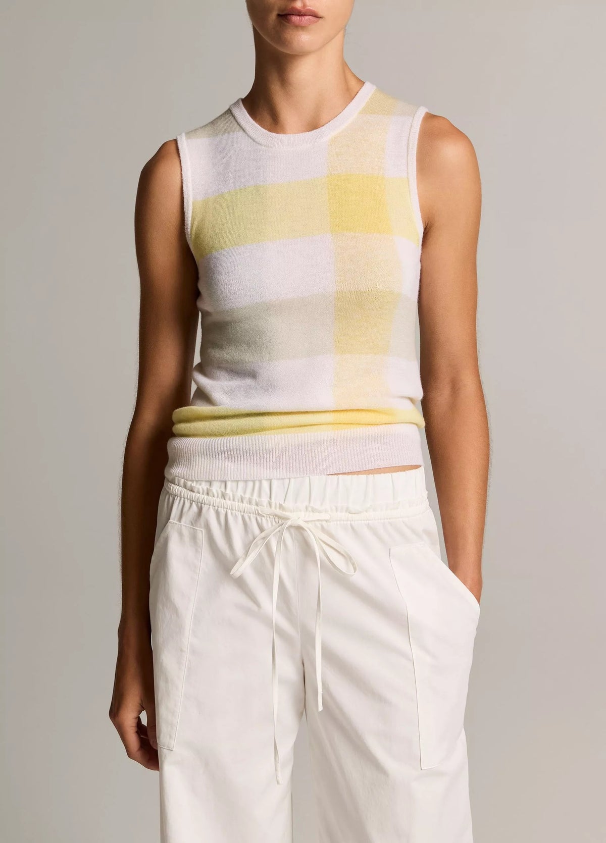 Model wears plaid tank with white pants2
