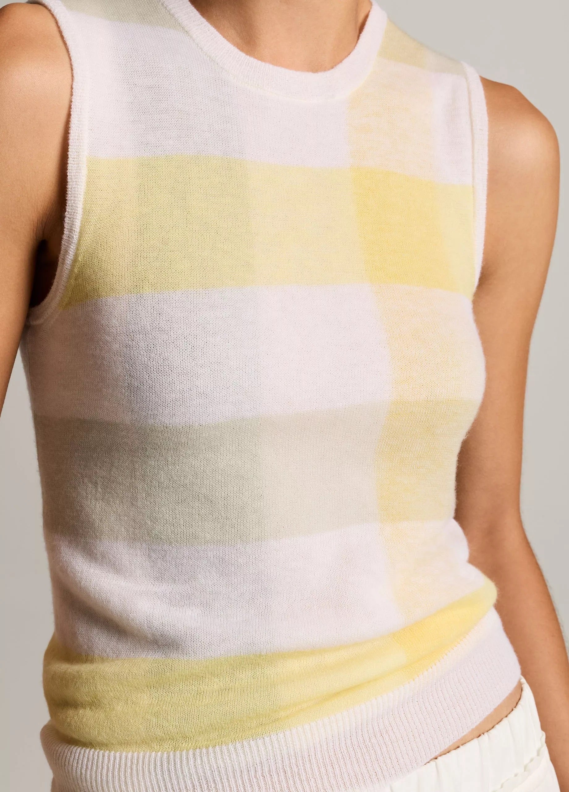 Model wears plaid tank with white pants1