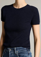 Woman wears a navy crew and jeans