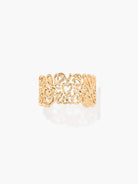 Gold BRACELET CUFF with intricate design on a white background